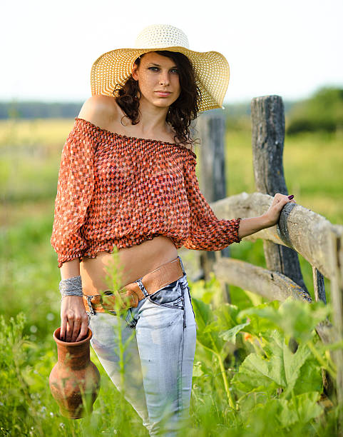 istock beautiful girl in a straw hat 166637060