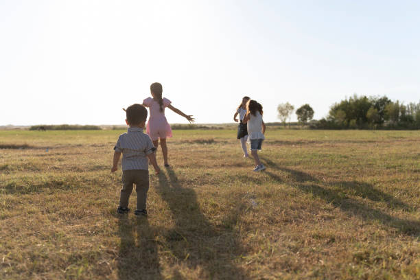 African elementary school kids running to camera in a field