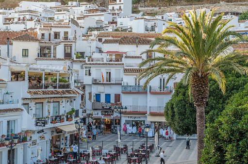 Mijas, Spain - October 9, 2021: View of a central square with shops and restaurants in the town of Mijas, located on the Costa del Sol, Malaga province, Andalusia, southern Spain