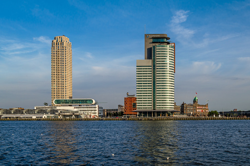 Rotterdam, the Netherlands - August 26, 2013: Urban landscape, view of skyscrapers standing close to the river Meuse, at Kop van Zuid neighborhood in Rotterdam, the Netherlands