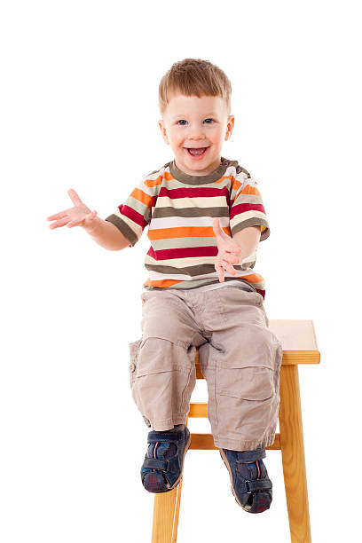 istock Little boy sitting on the stool 166639545