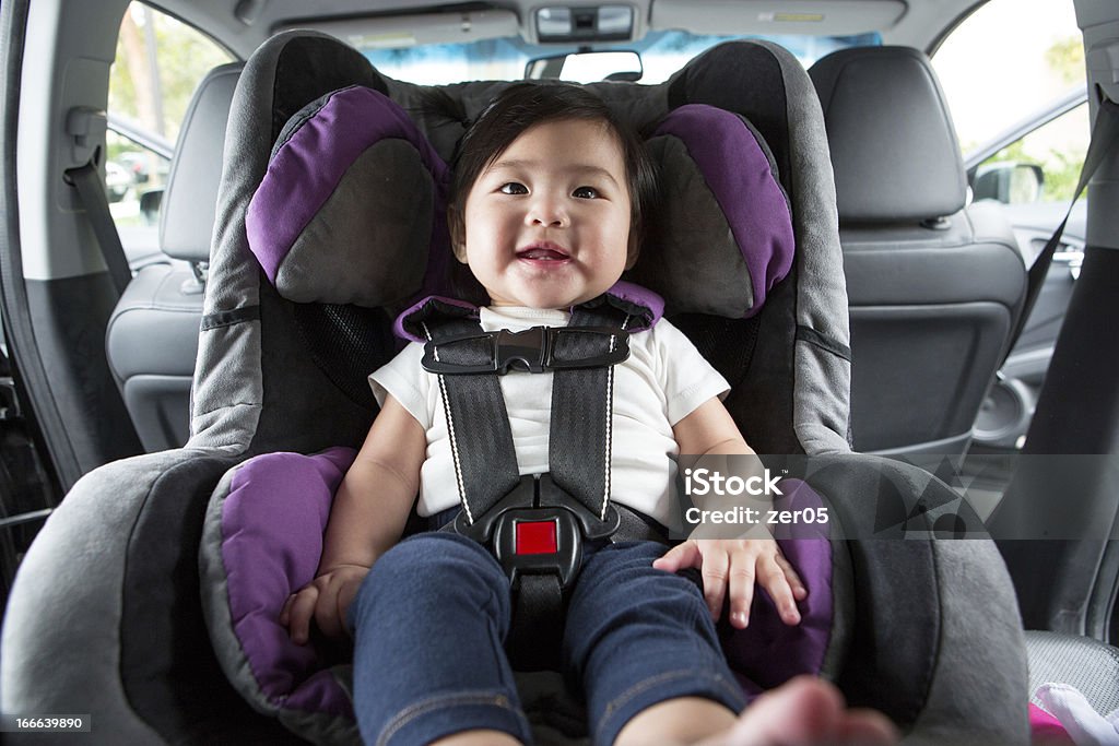 Baby in Car Seat Baby sitting in car seat, ready to go for a ride! Car Safety Seat Stock Photo