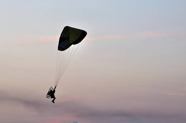 istock Paratrooper on clear blue sky at sunset 166640246
