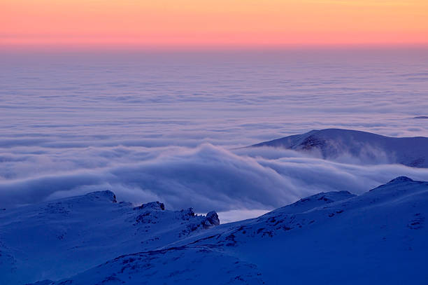 istock Clouds and mountains in winter season 166640363