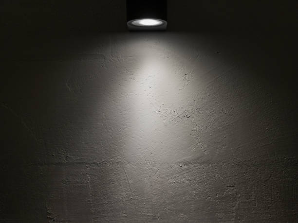 istock Spot light on a white wall in a dark room. 1666409452