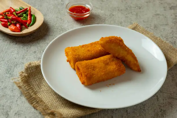 Some risoles filled with beef and mayonnaise which are delicious eaten with chili or chili sauce.