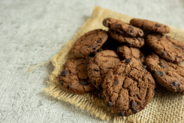 istock A pile of chocolate cookies with chocolate chips on top 1666489103
