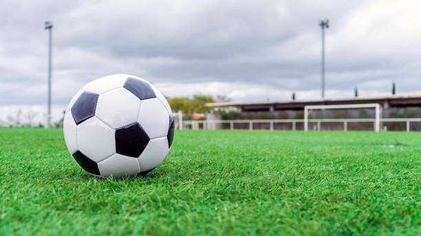 istock Soccer ball on the grass 1666511828