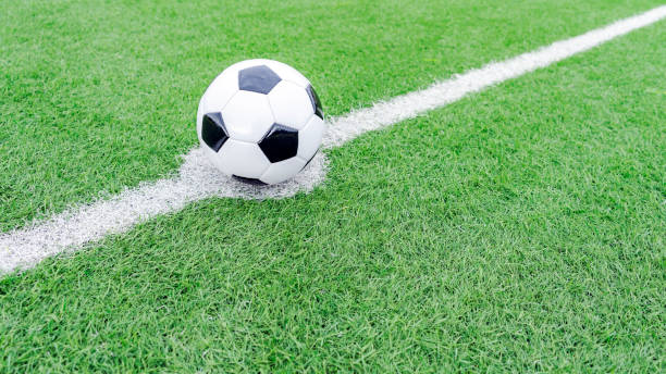 istock Soccer ball on the grass 1666522265