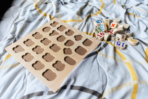 istock Montessori game on the bed. 1666552318