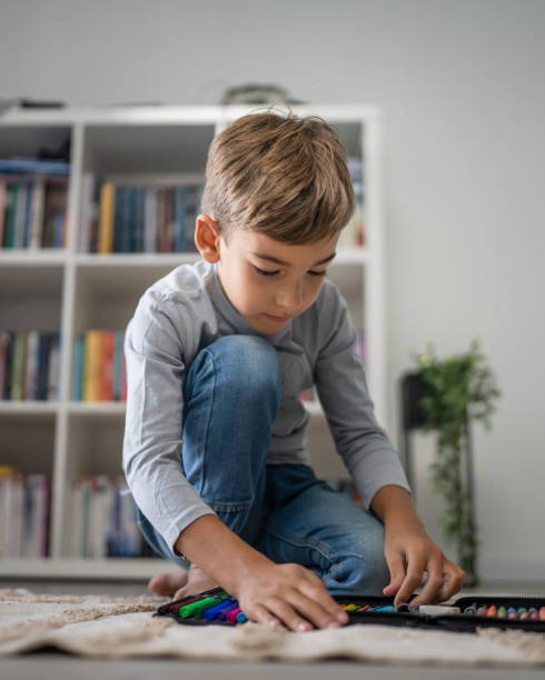 istock Small boy pupil child prepare his backpack for first day of school 1666553935