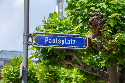 street name Paulsplatz - engl st. Pauls square in blue enamel at a street sign in Frankfurt, Germany