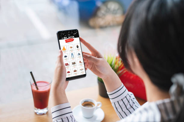 istock Online shopping from Black Friday discount while having a cup of coffee at a cafe. 1666558836