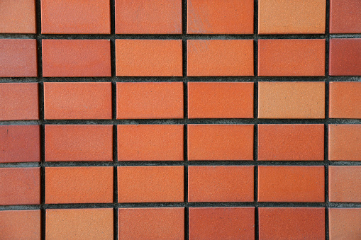 Orange brick wall texture background, close up of brick wall pattern.