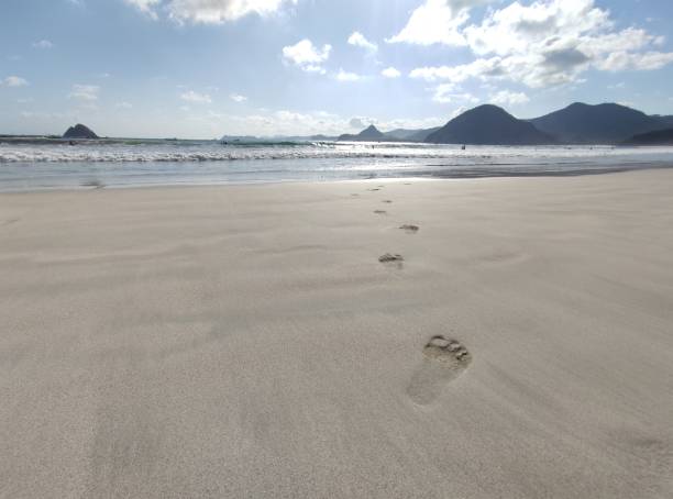 istock Foot print on the beach 1666622299