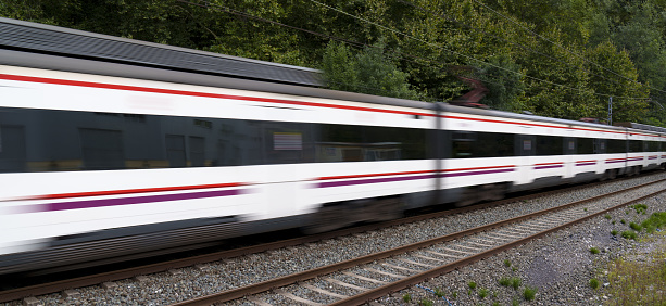 Train with passengers heads to the city at high speed.