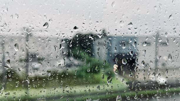 istock rain water on window reflection in window house and water drops 1666684912