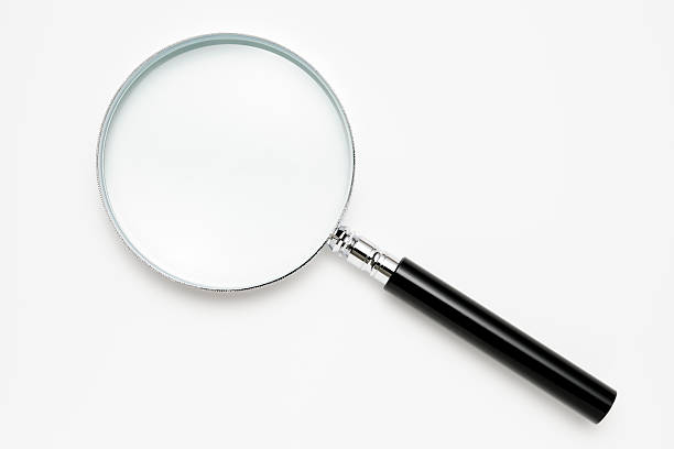 Isolated shot of magnifying glass on white background stock photo