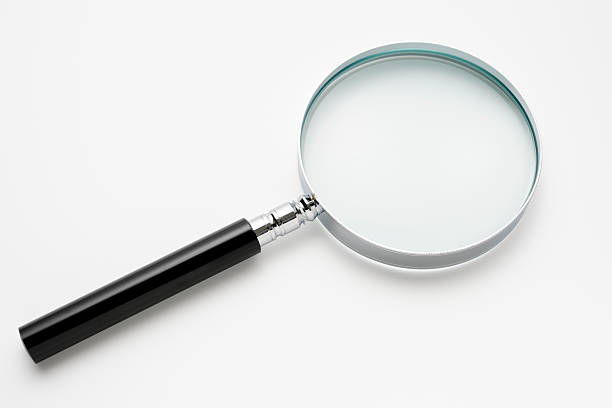 istock Isolated shot of magnifying glass on white background 166672184