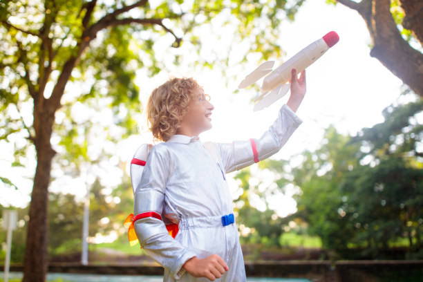 istock Little boy playing with spaceship. Astronaut kid. 1666724448