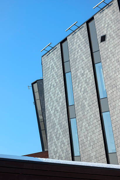 istock office building with gray walls on blue sky 166673739
