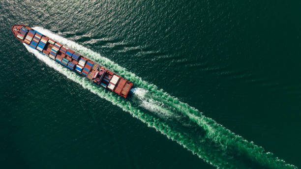 istock cargo container ship sailing full speed in sea to import export goods and distributing products to dealer and consumers worldwide, by container ship Transport, business logistic delivery service, aerial view 1666760791