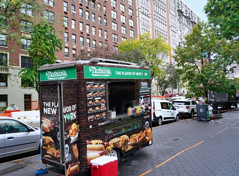 New York, NY - October 24, 2022:  New York City street with hot dog stand