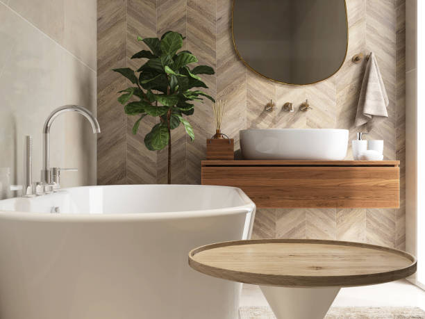 круглый деревянный приставной столик, ванна, фиговое дерево из листьев скрипки в роскошной дизайнерской ванной комнате при солнечном свет� - sink bathroom pedestal tile стоковые фото и изображения
