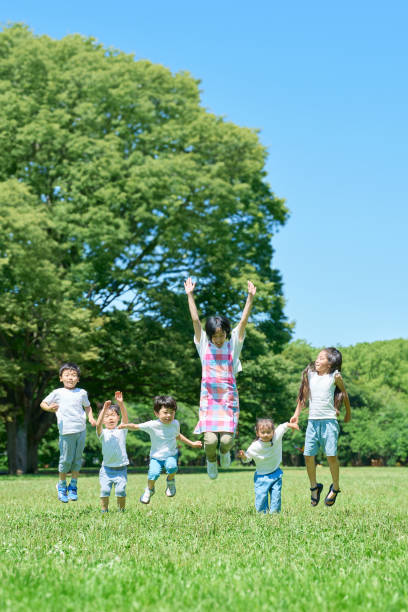istock Children and a woman jumping 1666766842