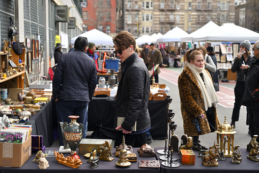 New York, USA - February 19, 2023: Unidentified people on the flea market in Manhattan, New York, United States
