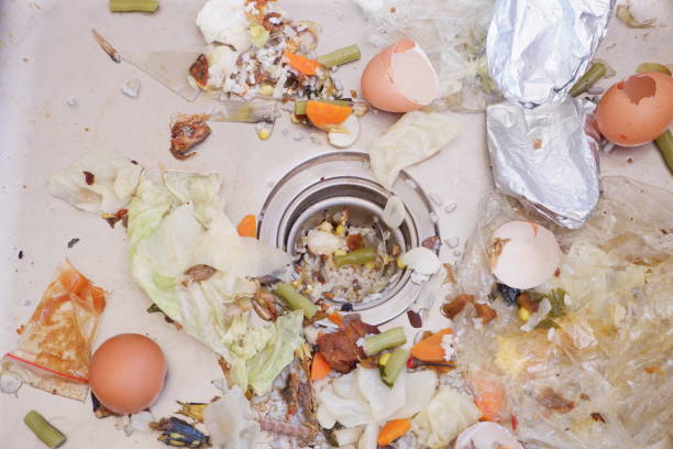 the sink is clogged with food residue. food waste can be used as natural compost stock photo