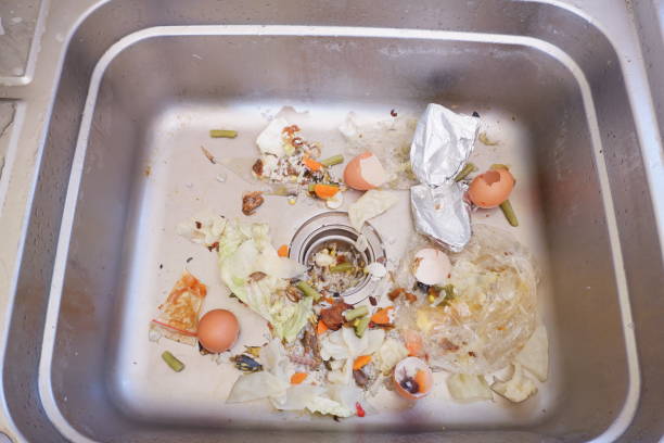 the sink is clogged with food residue. food waste can be used as natural compost stock photo