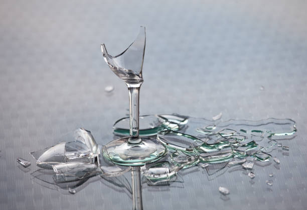 istock Broken Glass and Alcoholic Drink Alcoholism Concept 166678356