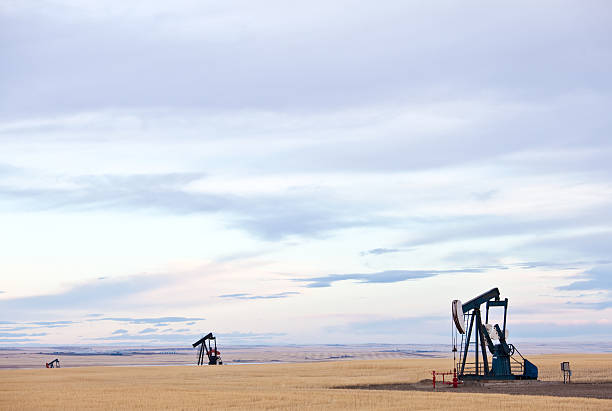 прерия pumpjacks - alberta prairie autumn field стоковые фото и изображения