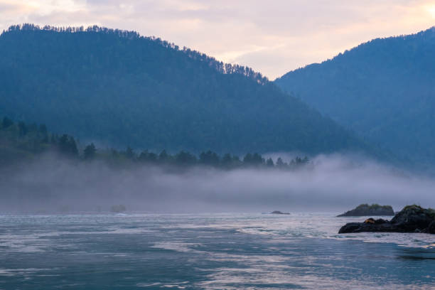 istock A wide, full-flowing mountain river with a fast current. 1666794279