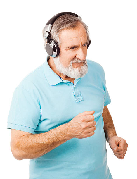 istock Senior man dancing with headphones 166681090