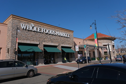 Folsom, California, USA - February 12, 2023
Storefront of a Whole foods market in Folsom on a clear day. 
Whole Foods Market, Inc., a subsidiary of Amazon, is an American multinational supermarket chain headquartered in Austin, Texas, which sells products free from hydrogenated fats and artificial colors, flavors, and preservatives.
