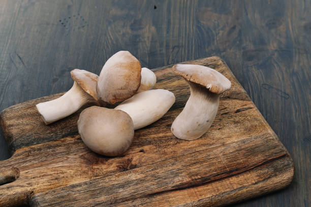 istock Group of king oyster mushroom on cutting board 1666859393