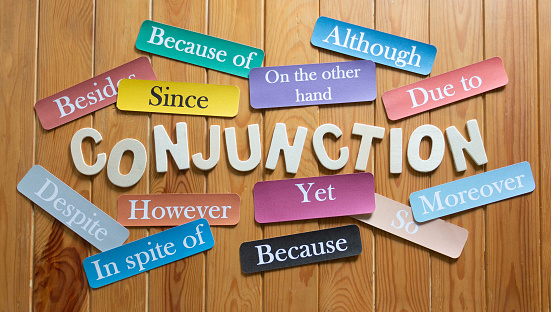 English colorful flashcards of conjuction words on wooden table