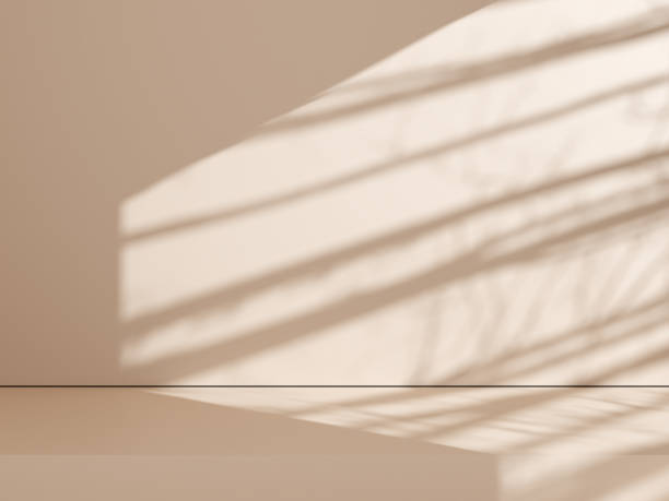 istock Simple product backdrop with shadow for product presentation. natural shadow on beige wall background. 1666901952
