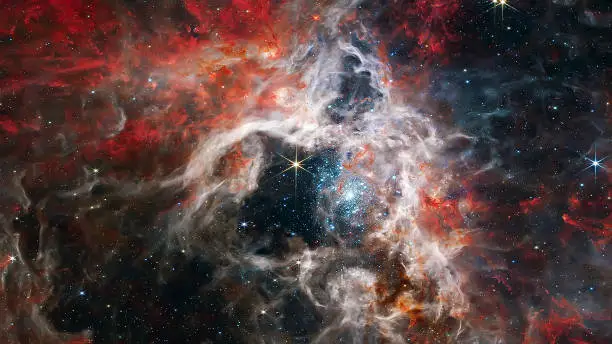 Cosmic Tarantula Nebula in outer space. James webb telescope. Elements of this image furnished by NASA.