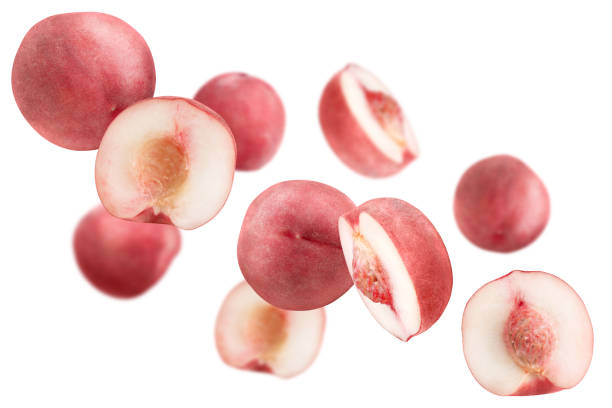 istock Levitation of pink peaches isolated on white background. 1666974073