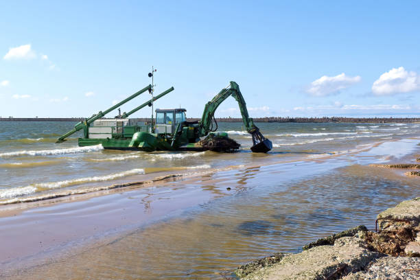 istock A floating excavator digs mud in the water. 1666977333