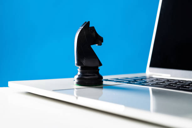 istock Chess knight on laptop keyboard 1667000451