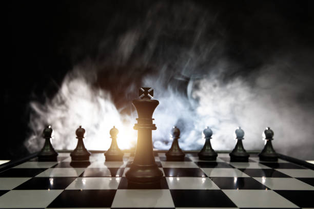istock Chess king and pawns on the chess board 1667001033