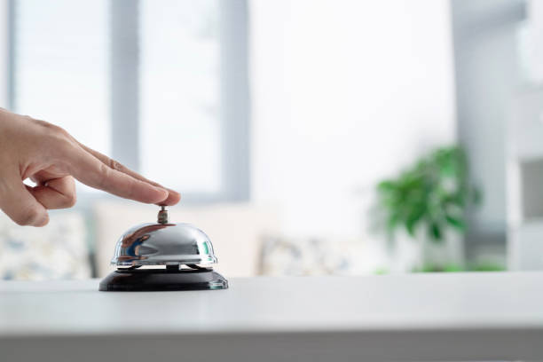 istock Woman hand ringing a service bell 1667003673