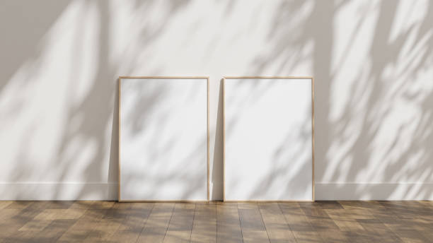 istock Photo frame mockup leaning against wall on wooden floor 1667013360