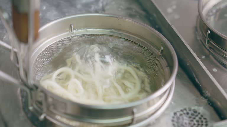 closeup shot about noodles cooking in boil water