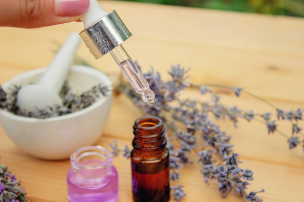 istock lavender essential oil, on a wooden background. Selective focus 1667105787
