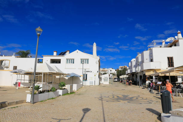 Beautiful cobblestone Promenade at Praia da Luz, Algarve Praia da Luz, Algarve, Portugal- October 20, 2022: Beautiful cobblestone promenade at Praia da Luz, Algarve, Portugal luz solar stock pictures, royalty-free photos & images